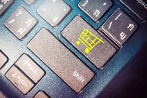 Online Shopping concept, close up button with  shopping cart icon on keyboard Stock Photos