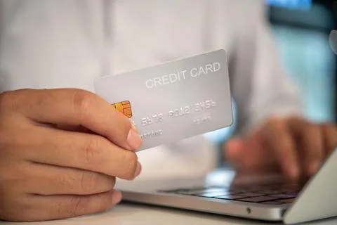 Online shopping e-commerce or internet banking concept.Man hand holding cre.. Stock Photos