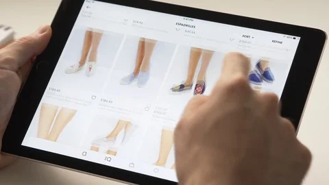 Online Shopping for Female Shoes On Tablet Device Stock Footage