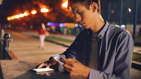 Online Shopping. Mobile Phone. Using phone. Night city. Stock Footage 89990962