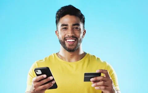 Online shopping, surprise and happy man with credit card, phone and digital bank Stock Photos