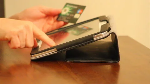 Online shopping using tablet and credit card Stock Footage 40805756