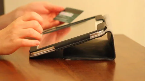 Online shopping using tablet and back of credit card Stock Footage 40807069