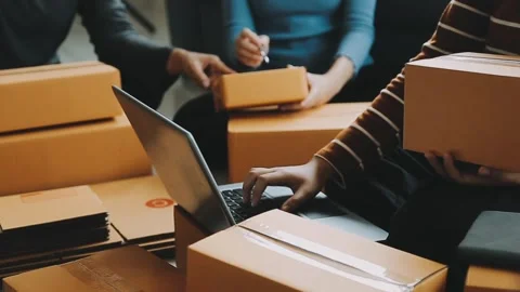 Online Store Owner Preparing Parcels For Delivery on Laptop 스톡 동영상 325421033