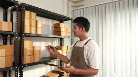 An online store owner preparing product packages for delivery 库存影片 342263471