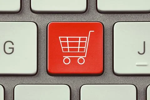 Online store purchase. Red button with shopping cart on computer keyboard, .. Foto stock