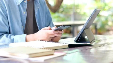 Online study class, Man hand student using mobile phone and digital tablet fo Foto stock