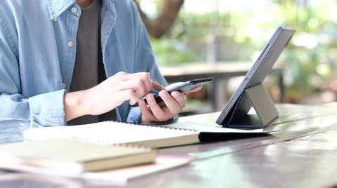 Online study, Man hand using mobile phone for digital home study class, Adult Stock Photos