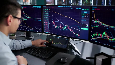 Online Trading Agent Man With Multiple Monitors Stock Footage 328394353