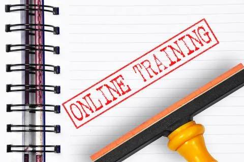 Online training rubber stamp on the note book Stock Photos