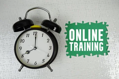 Online Training text with alarm clock on green background Stock Photos