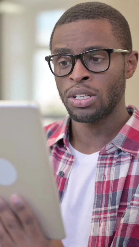 Online Video Chat on Tablet by African Man, Vertical Video Stock Footage 340041276