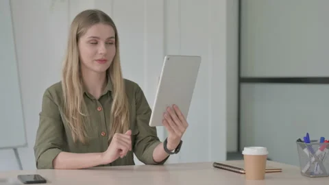 Online Video Chat on Tablet by Young Blonde Woman 動画素材 212914024