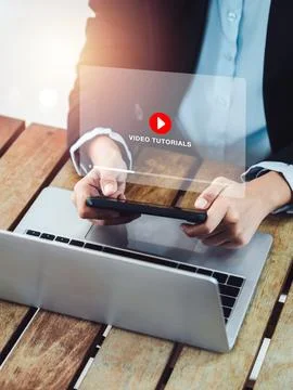 Online video tutorial concept. Red play icon on video tutorial virtual scre.. Stock Photos