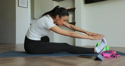 Online video tutorial while virtual training at home. Workout at home in li.. Stock Photos