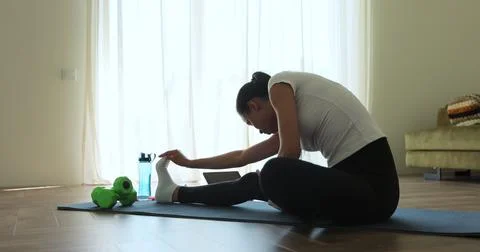 Online video tutorial while virtual training at home. Workout at home in li.. Stock Photos