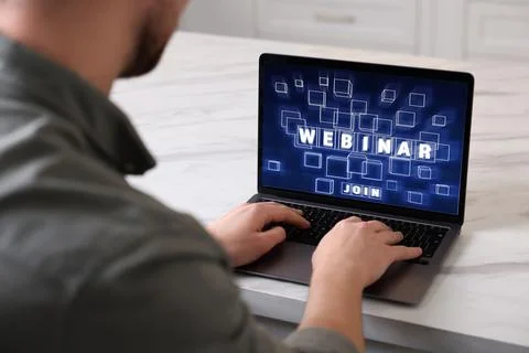 Online webinar, web page on computer screen. Man using laptop at light tabl.. Stock Photos