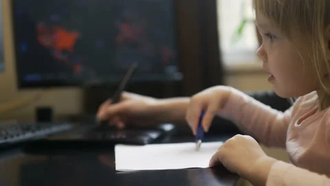 Online working through quarantine with a child, mommy and baby are drawing Stock Footage 150489547