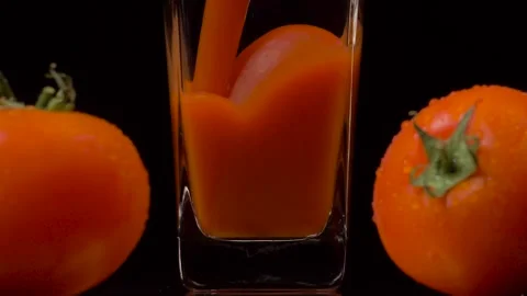 Only the best tomatoes. Super slow motion shot of pouring tomato juice into a Video stock 147413070