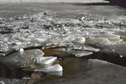 Only the broken ice on the water surface on the river in the spr Stock Photos