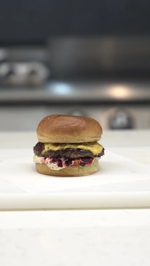 Only burger cutting in the kitchen Stock-Footage 311532457
