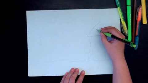 Only hand. The view from the top. The child draws on white paper. Color dreams Video stock 89156598