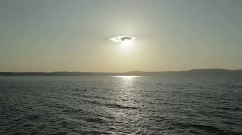 Only one cloud covering the sun on a lake landscape Stock Footage 11114833