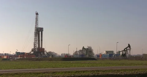 Onshore drilling platform and pumpjack oil field surface location Emlichheim Stock Footage 73431801