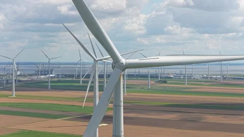 Onshore wind farm close up of rotor blades generating clean green power Stock Footage 315980727