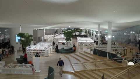 Oodi Central Library third floor interior view with bookshelves and stairs Stock Footage 326638627