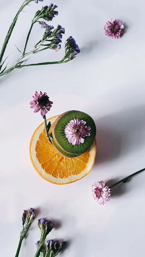 Ooking down, scene, kiwi, oranges, flowers, arrangement, composition, visual, Stock Footage 267265674