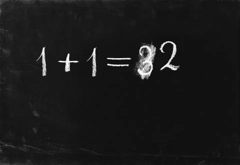 Ooops. simple math operation 2+2= writing chalk on blackboard. Stock Photos