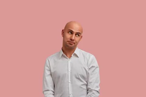 Oops. Awkward bald guy with bristle, ignoring expression said something wrong Stock Photos