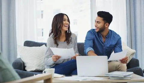 Oops, got caught over another pair of shoes. a happy young couple sitting on the Stock Photos