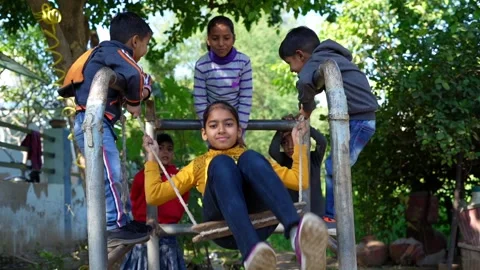 Oops movement on swing, Indian kids enjoying outdoor game. Little children .. Stock Footage 251202010