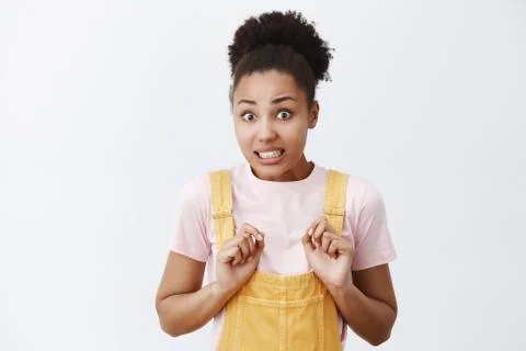 Oops sorry, doest it hurt. Portrait of nervous cute African American girlfriend Stock Photos