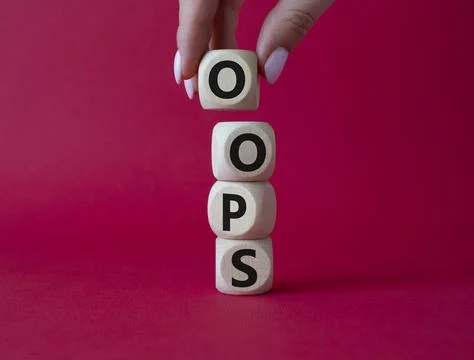 Oops symbol. Concept word Oops on wooden cubes. Businessman hand. Beautiful.. Foto stock