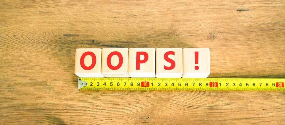 Oops symbol. Concept word Oops on beautiful wooden blocks. Beautiful wooden.. 스톡 사진