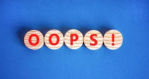 Oops symbol. Concept word Oops on beautiful wooden circles. Beautiful blue .. 스톡 사진