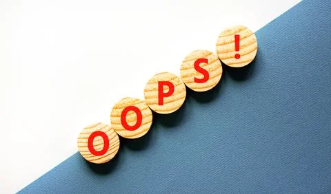 Oops symbol. Concept word Oops on beautiful wooden circles. Beautiful blue .. 스톡 사진