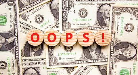 Oops symbol. Concept word Oops on beautiful wooden circles. Beautiful dollar  Stock Photos