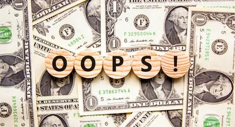 Oops symbol. Concept word Oops on beautiful wooden circles. Beautiful dollar  스톡 사진