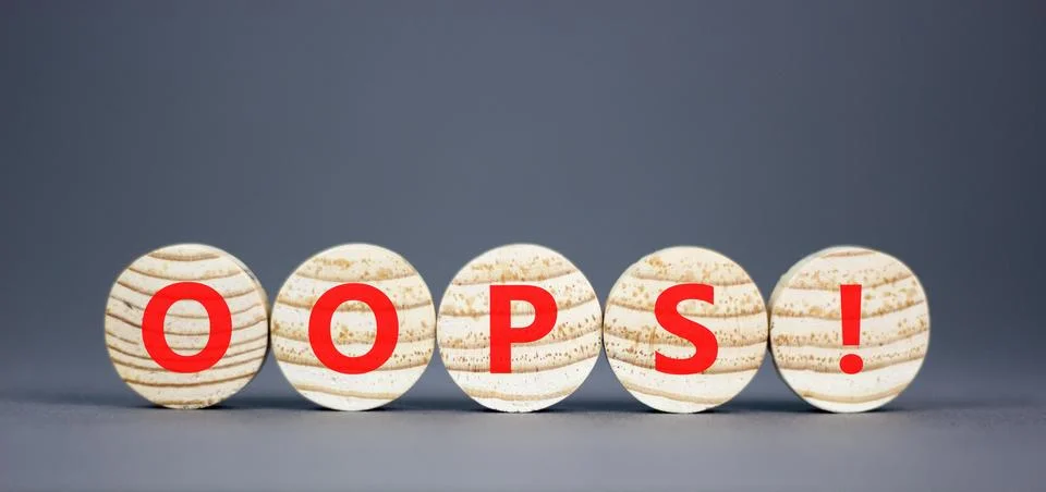 Oops symbol. Concept word Oops on beautiful wooden circles. Beautiful grey .. Stock Photos