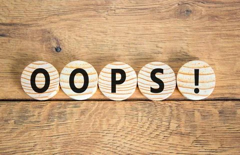 Oops symbol. Concept word Oops on beautiful wooden circles. Beautiful woode.. Stock Photos