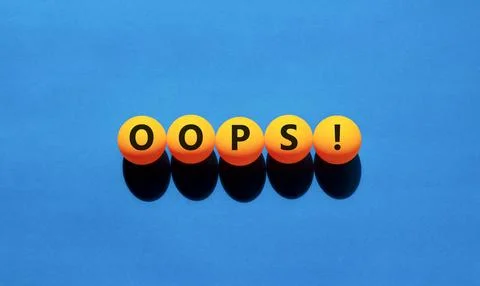 Oops symbol. Concept word Oops on beautiful yellow tennis ping pong balls. .. Stock Photos