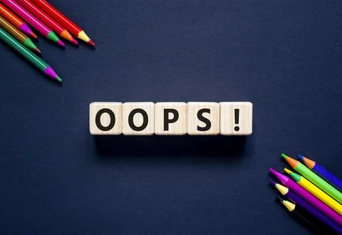 Oops symbol. Concept word Oops on beautiful wooden blocks. Beautiful black .. Stock Photos