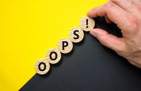 Oops symbol. Concept word Oops on beautiful wooden circles. Beautiful yello.. Stock Photos
