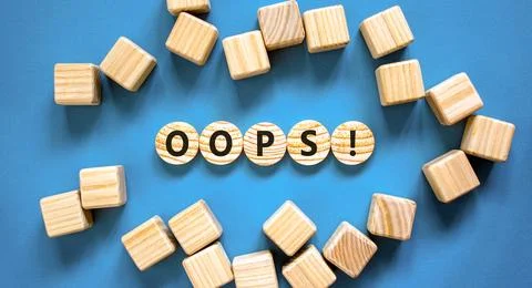 Oops symbol. Concept word Oops on beautiful wooden circles. Beautiful blue .. Stock Photos
