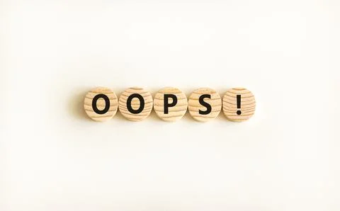Oops symbol. Concept word Oops on beautiful wooden circles. Beautiful white.. Stock Photos