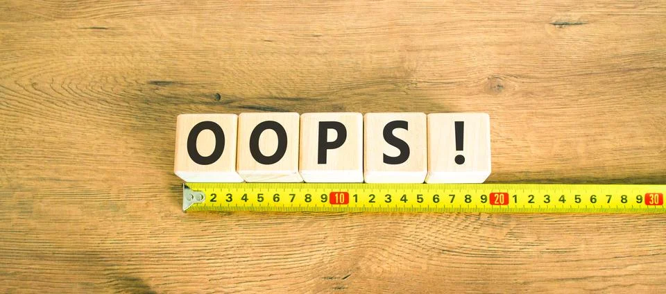 Oops symbol. Concept word Oops on beautiful wooden blocks. Beautiful wooden.. Stock Photos